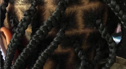 Detailed braided hairstyle at Platinum's Beauty Studio in Burlington, North Carolina, US.