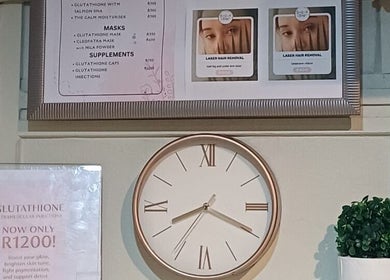 Clock and beauty treatment menu at BEAUTY WITH FAMZ, Durban, Kwazulu-natal, ZA.