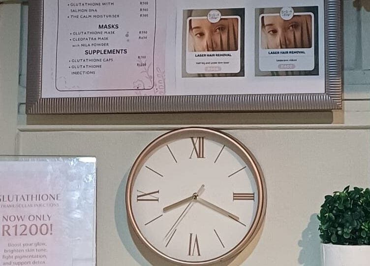 Clock and beauty treatment menu at BEAUTY WITH FAMZ, Durban, Kwazulu-natal, ZA.