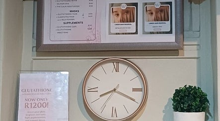 Clock and beauty treatment menu at BEAUTY WITH FAMZ, Durban, Kwazulu-natal, ZA.