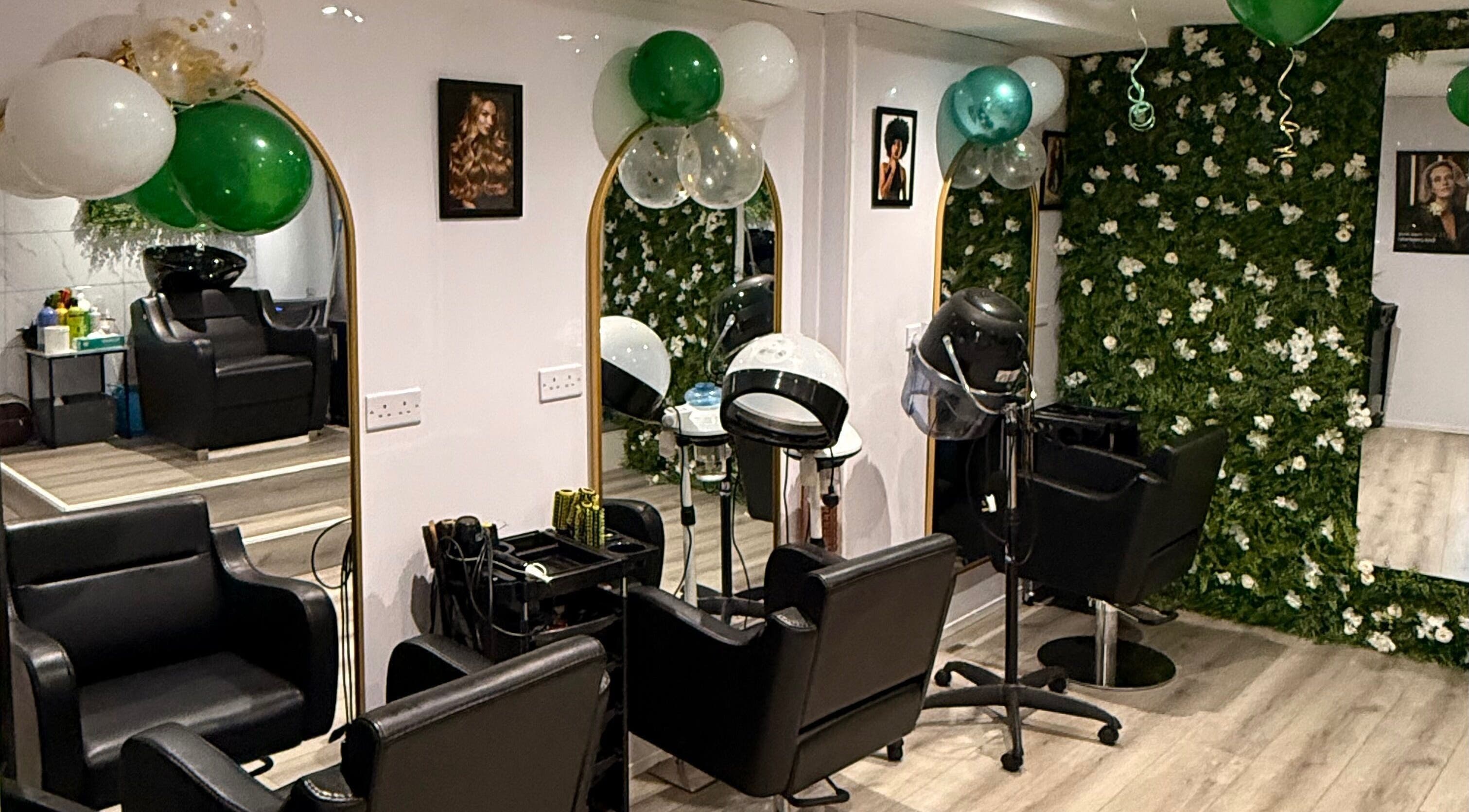 Elegant interior of Regal Essence Beauty Studio (REBS) in Rochdale, England, GB with floral decor and salon chairs.