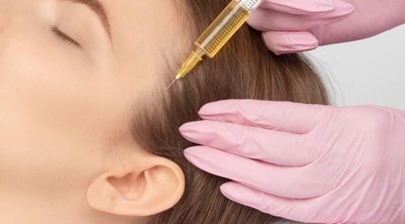 Hair treatment at 7even Trichology Clinic in London, England, GB, featuring a careful scalp injection procedure.
