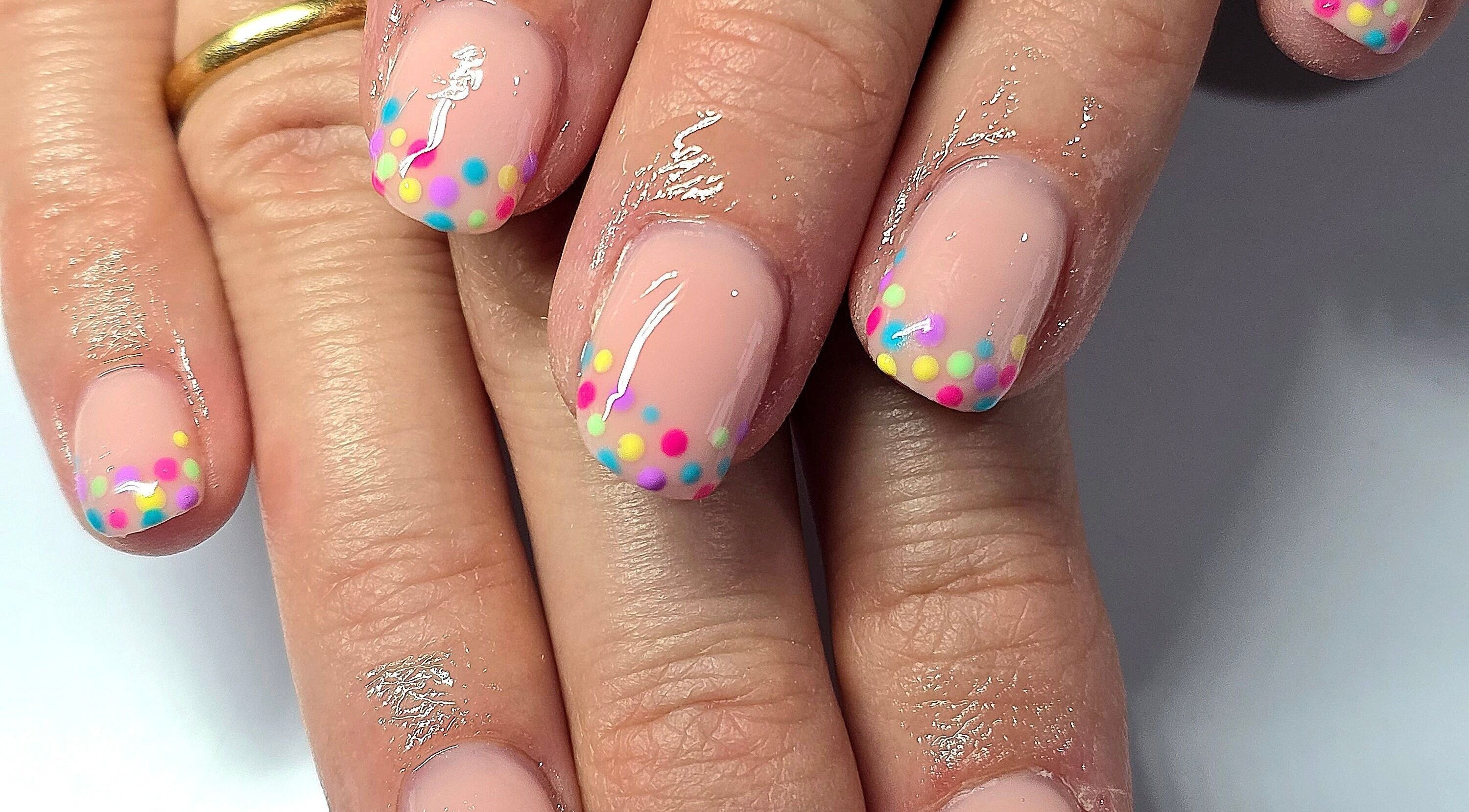 Vibrant nail art with colorful dots at Meraki Beaute MBS in Stoke-on-Trent, England, GB.