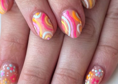 Vibrant nail art at Meraki Beaute MBS, Stoke-on-Trent, England, GB featuring colorful patterns on nails.