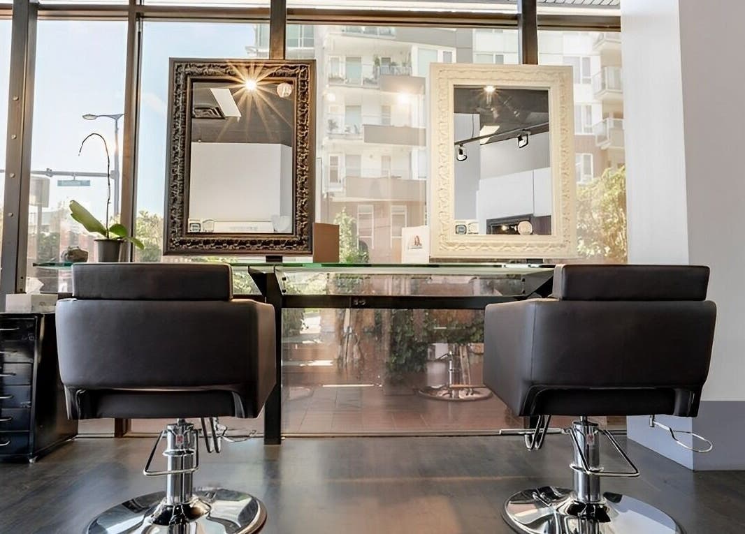 Modern salon chairs and mirrors at Luxevoir Hair Lounge & Spa, North Vancouver, British Columbia, CA.