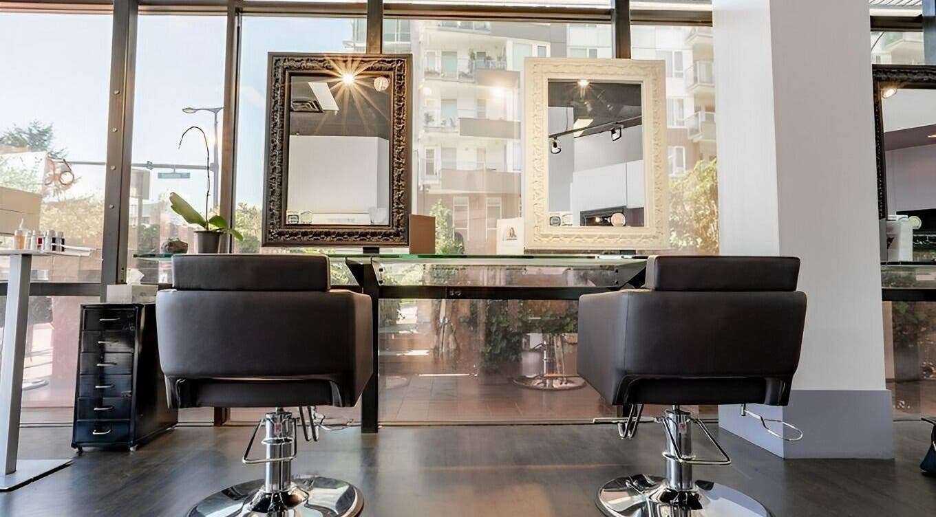 Modern salon chairs and mirrors at Luxevoir Hair Lounge & Spa, North Vancouver, British Columbia, CA.