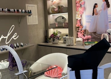 Stylish nail area at La Perle Beauty Lounge, Al Khobar, Eastern Province, SA, featuring upscale decor and products.