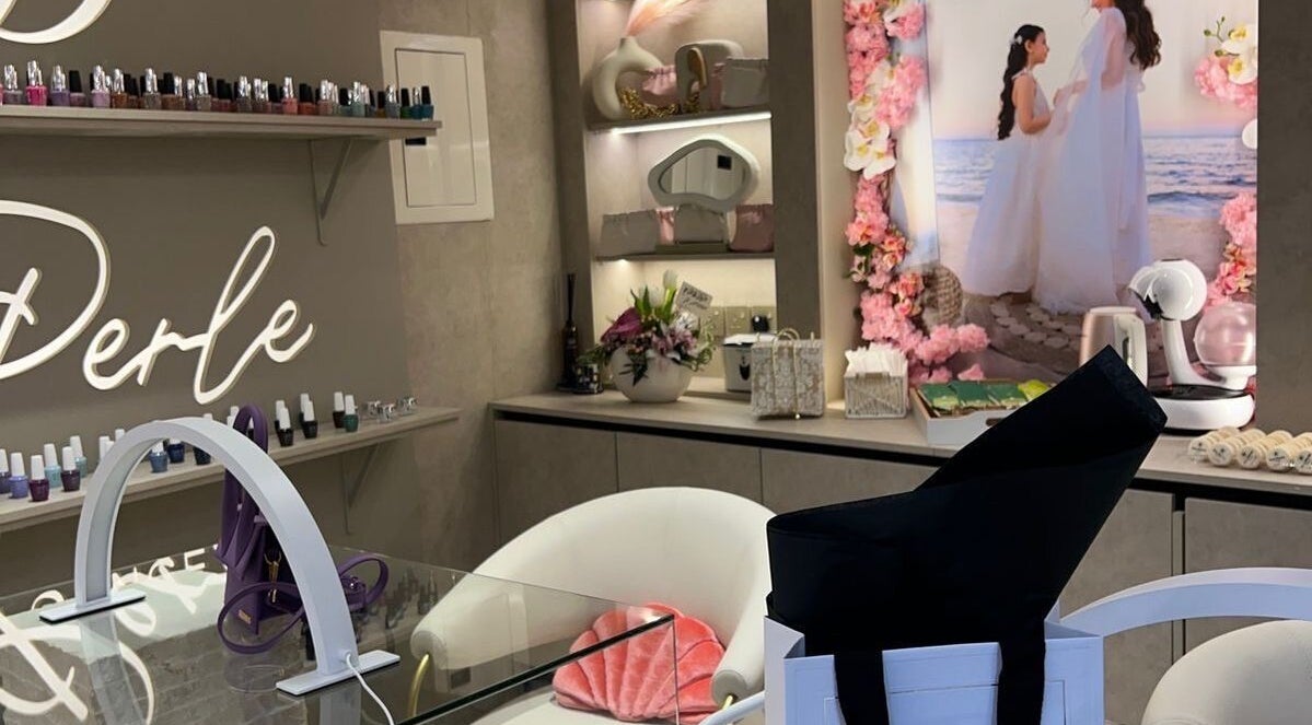 Stylish nail area at La Perle Beauty Lounge, Al Khobar, Eastern Province, SA, featuring upscale decor and products.