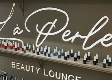 Nail polish display at La Perle Beauty Lounge, Al Khobar, Eastern Province, SA, showcasing vibrant hues.