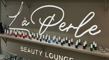 Nail polish display at La Perle Beauty Lounge, Al Khobar, Eastern Province, SA, showcasing vibrant hues.