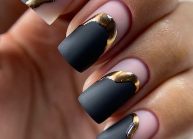 Elegant black and gold nail art at La Perle Beauty Lounge, Al Khobar, Eastern Province, SA.