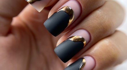 Elegant black and gold nail art at La Perle Beauty Lounge, Al Khobar, Eastern Province, SA.