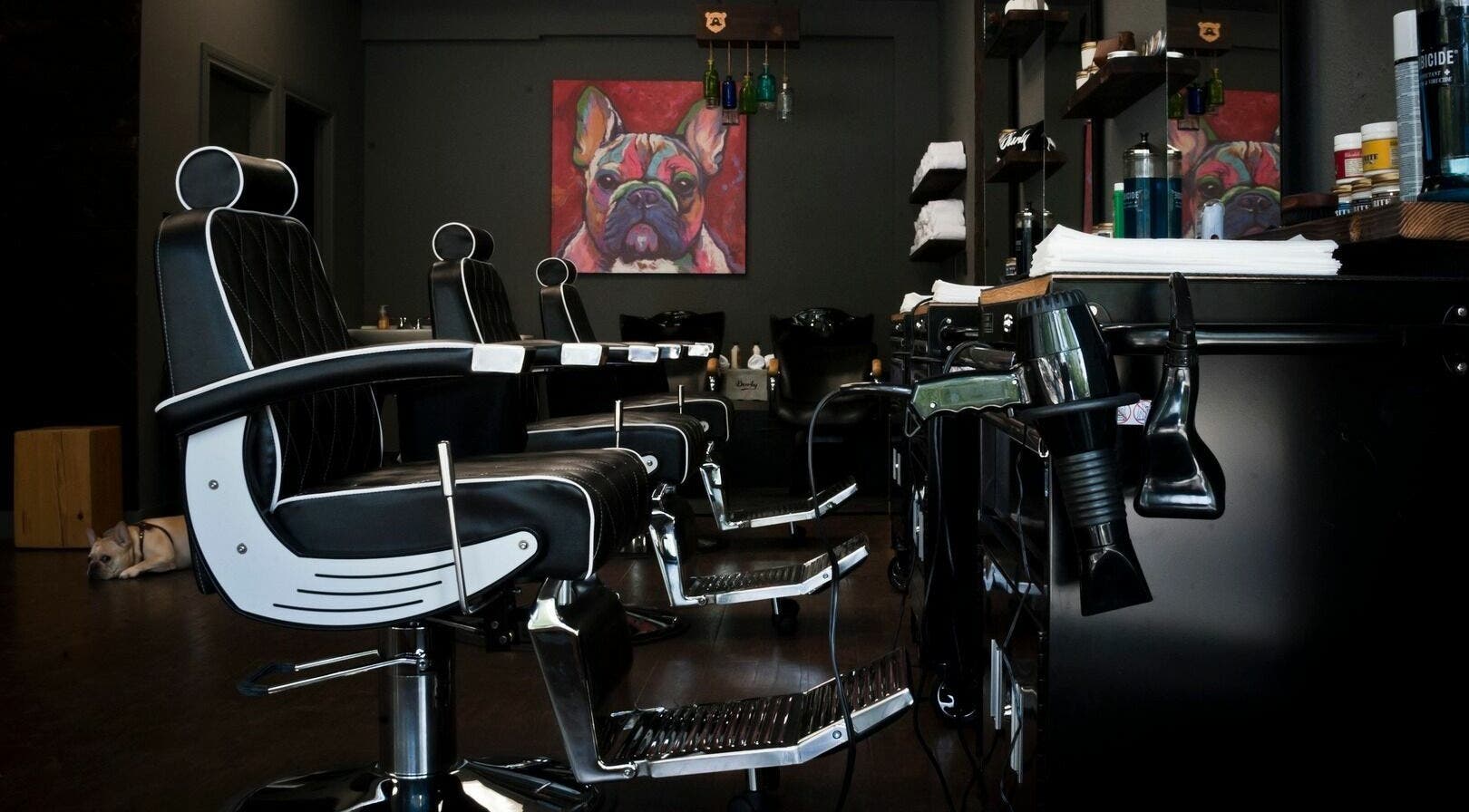 Chic barber chairs at Burly Barber, Vancouver, British Columbia, CA, ready for a haircut service.