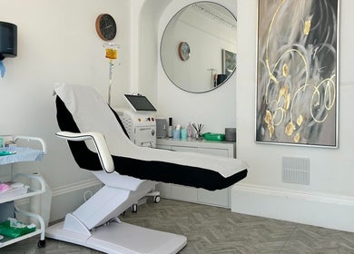 Modern treatment room at Aesthetic Medical LTD in Trowbridge, England, GB with chic decor and recliner chair.