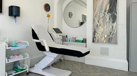 Modern treatment room at Aesthetic Medical LTD in Trowbridge, England, GB with chic decor and recliner chair.