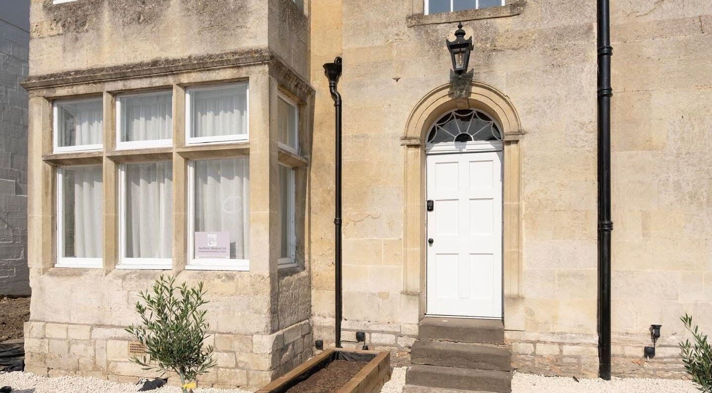 Charming stone facade at Aesthetic Medical LTD, Trowbridge, England invites guests to wellness excellence.