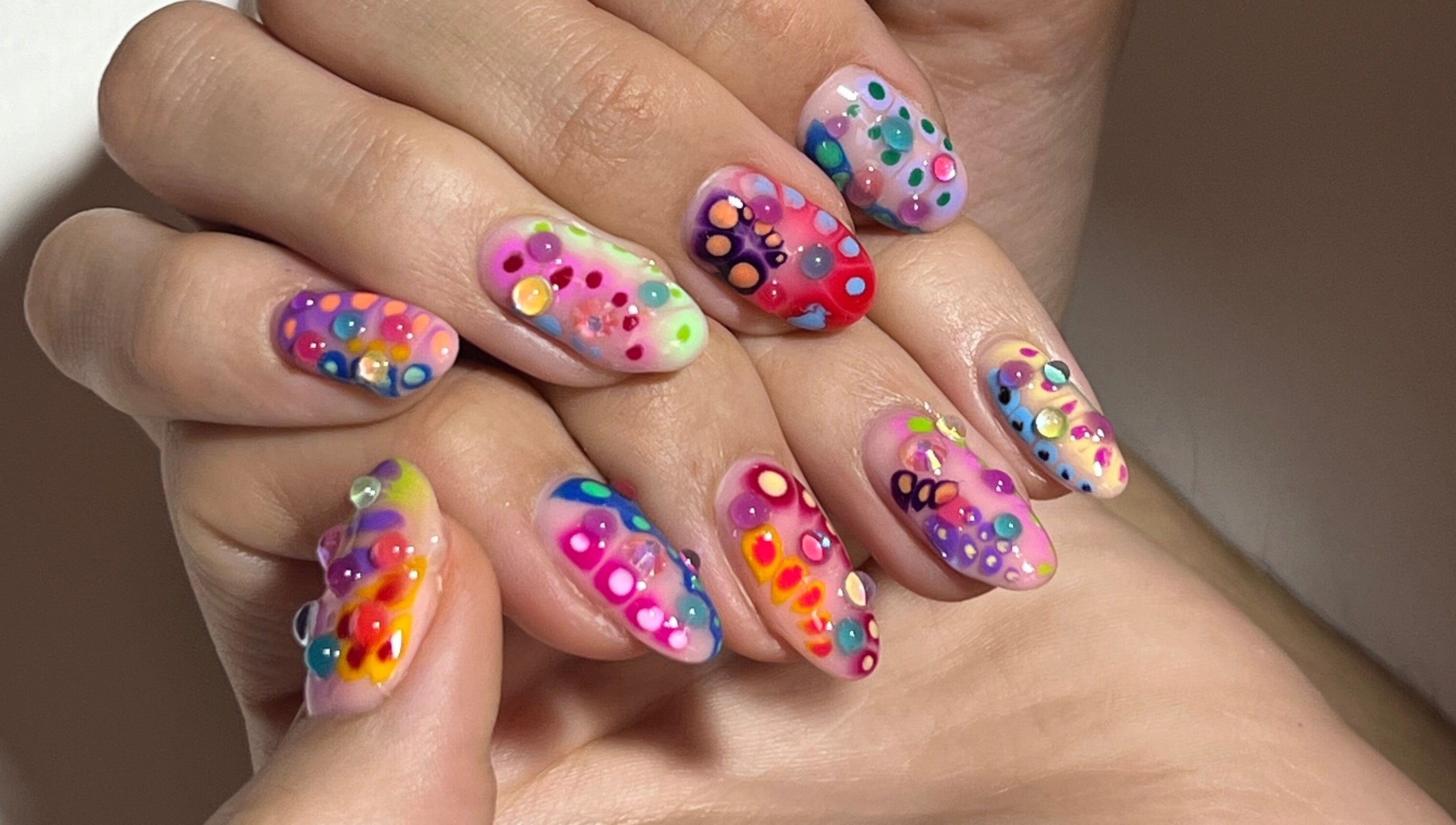 Vibrant nail art at Gelalicious Nails in East Victoria Park, Western Australia, AU featuring multicolored designs.