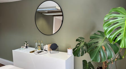 Elegant beauty space at BL.INK STUDIO, Fakenham, England, with mirror and leafy plant.