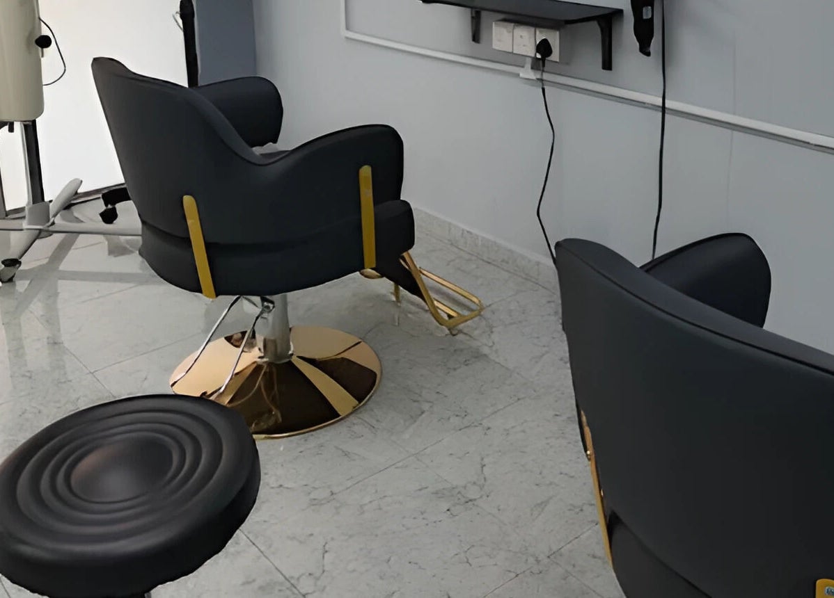 Modern salon chairs at Erma Hair Studio in Kangar, Perlis, MY, showcasing sleek interior design.
