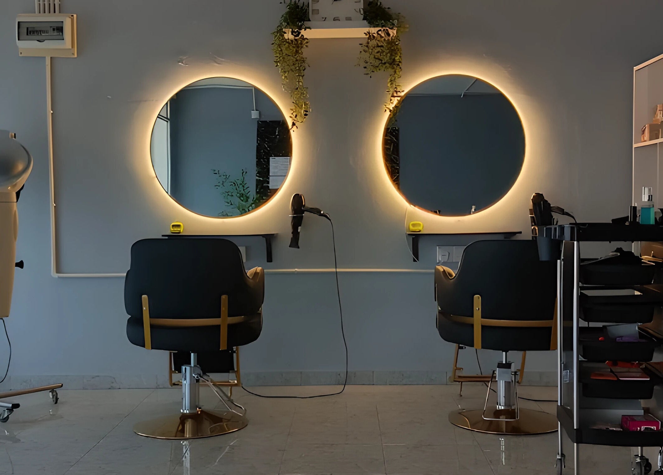 Modern salon interior with illuminated mirrors at Erma Hair Studio, Kangar, Perlis, MY.