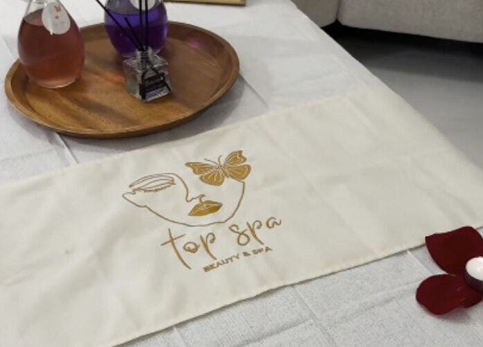 Calm spa setup at Top Spa Home Services توب سبا للنساء, Riyadh, Riyadh Province, SA with candle and oils.