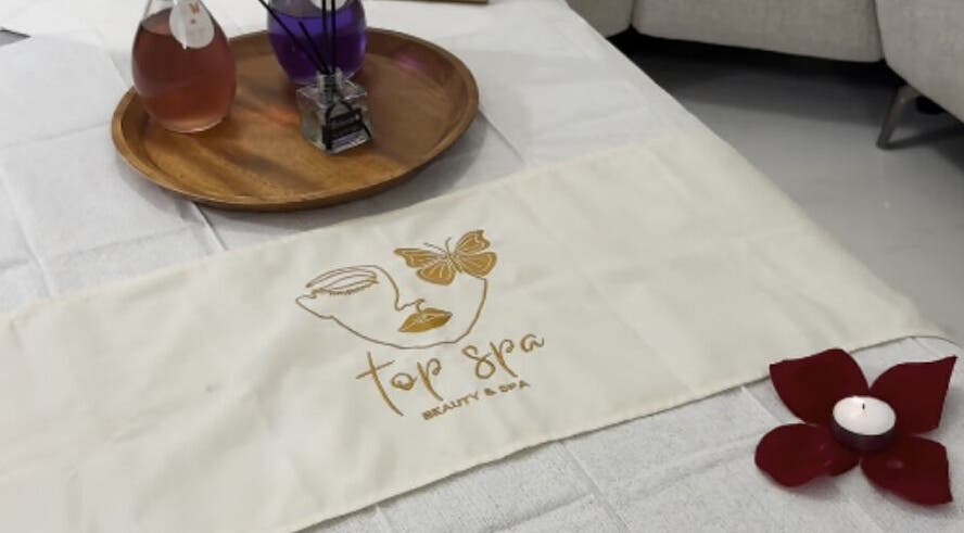 Calm spa setup at Top Spa Home Services توب سبا للنساء, Riyadh, Riyadh Province, SA with candle and oils.