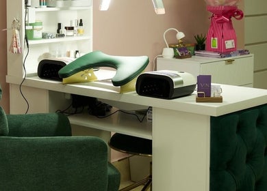 Nail station at Clover Beauty Studio Limited in Ennis, County Clare, IE featuring green velvet chair.