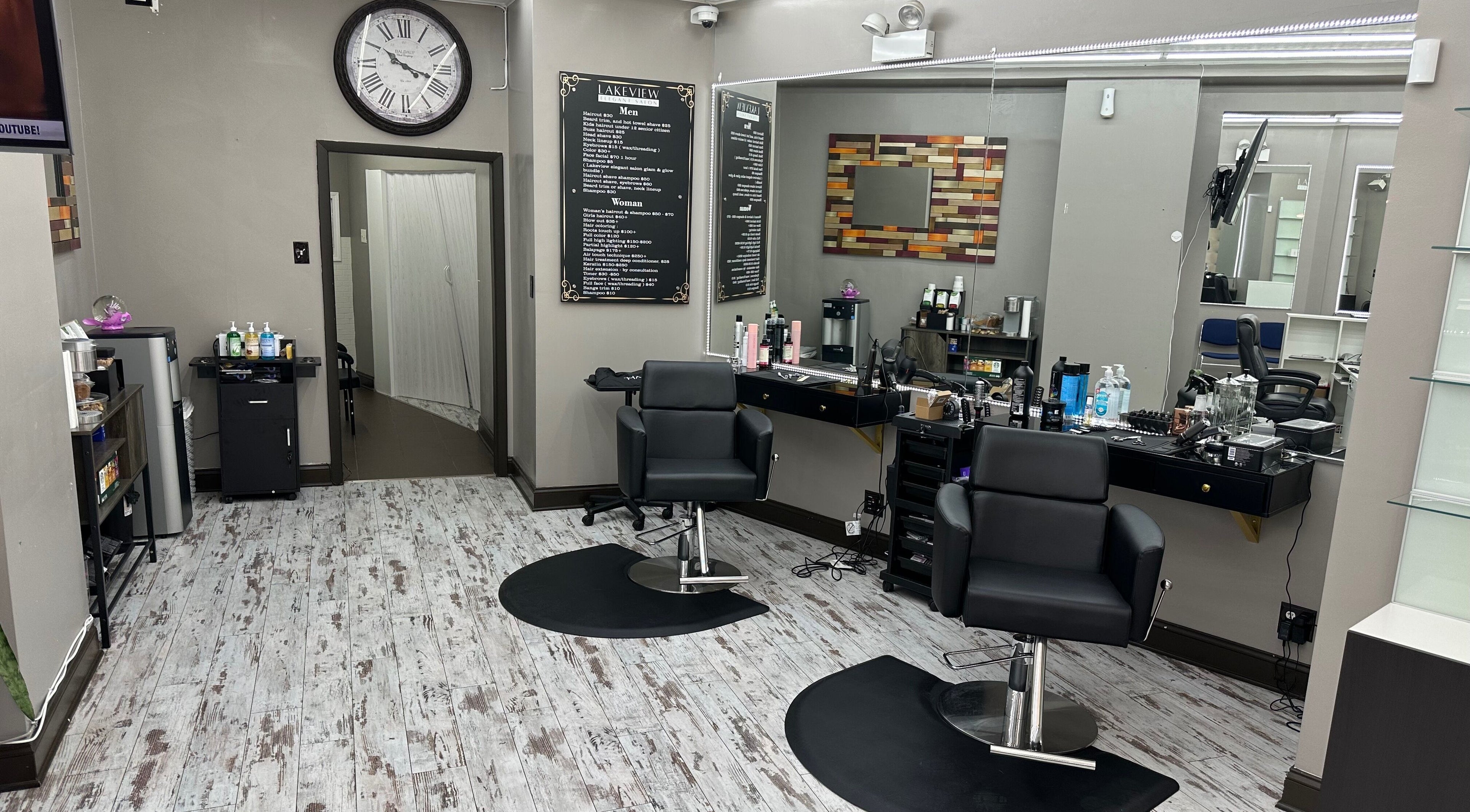 Modern chic interior of Lakeview Elegant Salon in Chicago, Illinois, US with stylish salon chairs and decor.