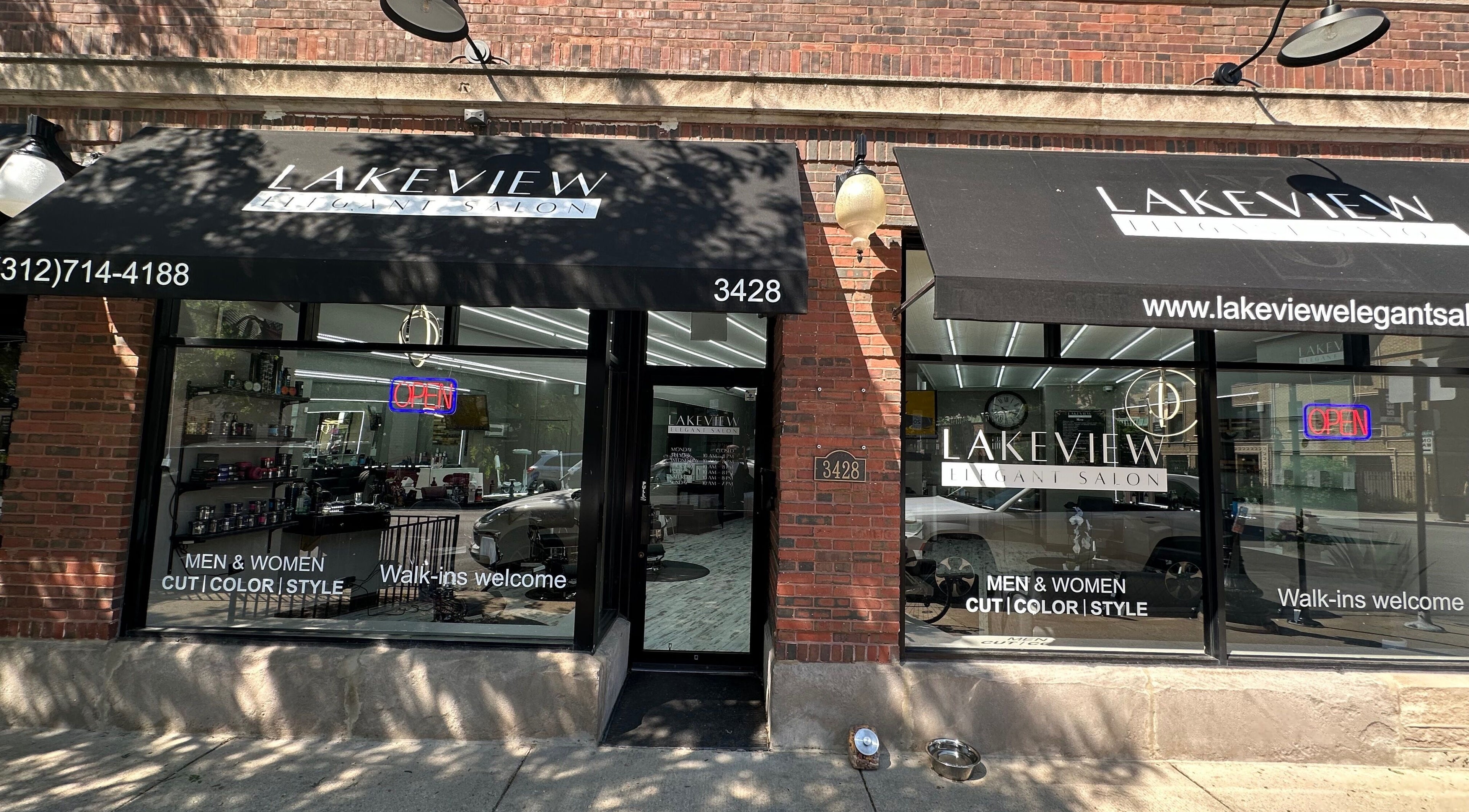Front view of Lakeview Elegant Salon in Chicago, Illinois, US with stylish black awnings.