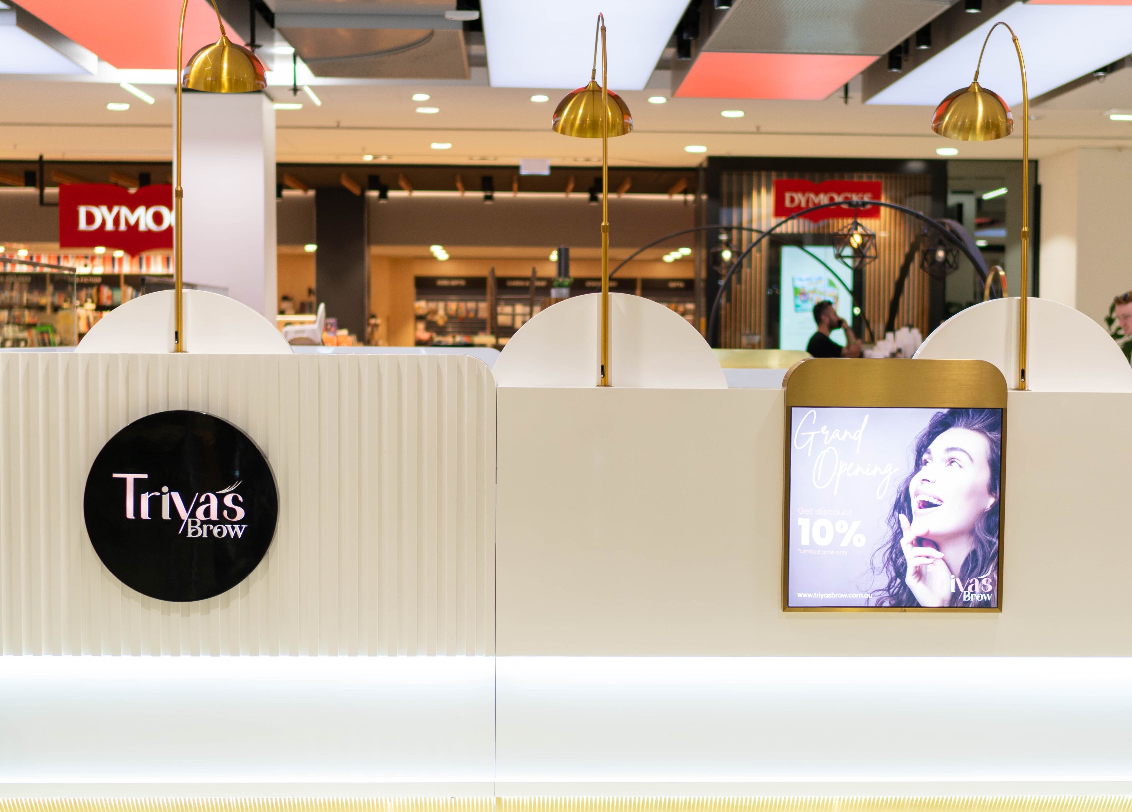 Triya's Brows & Lashes in Bondi Junction, New South Wales, AU. Modern kiosk interior with promotional signage.