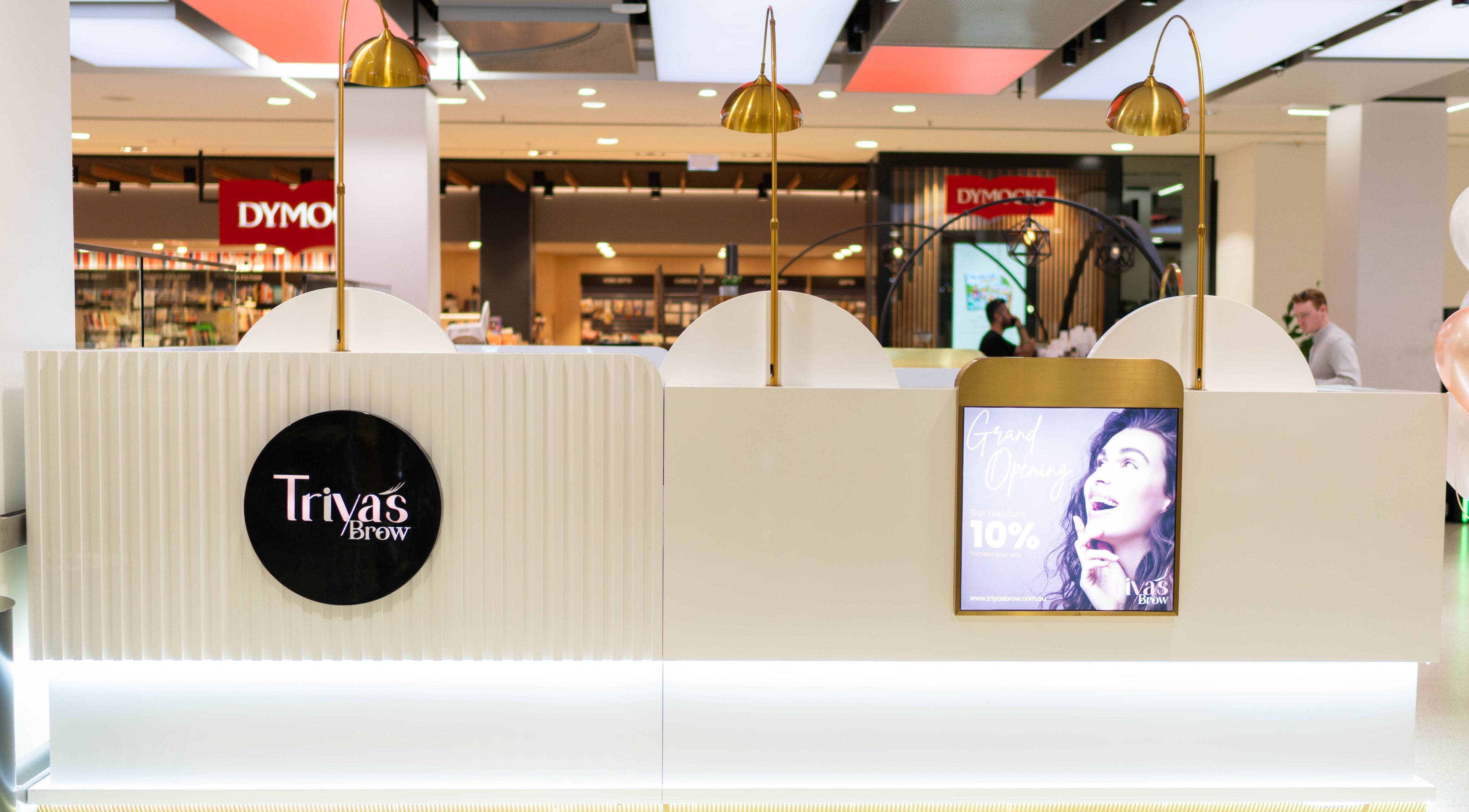 Triya's Brows & Lashes in Bondi Junction, New South Wales, AU. Modern kiosk interior with promotional signage.