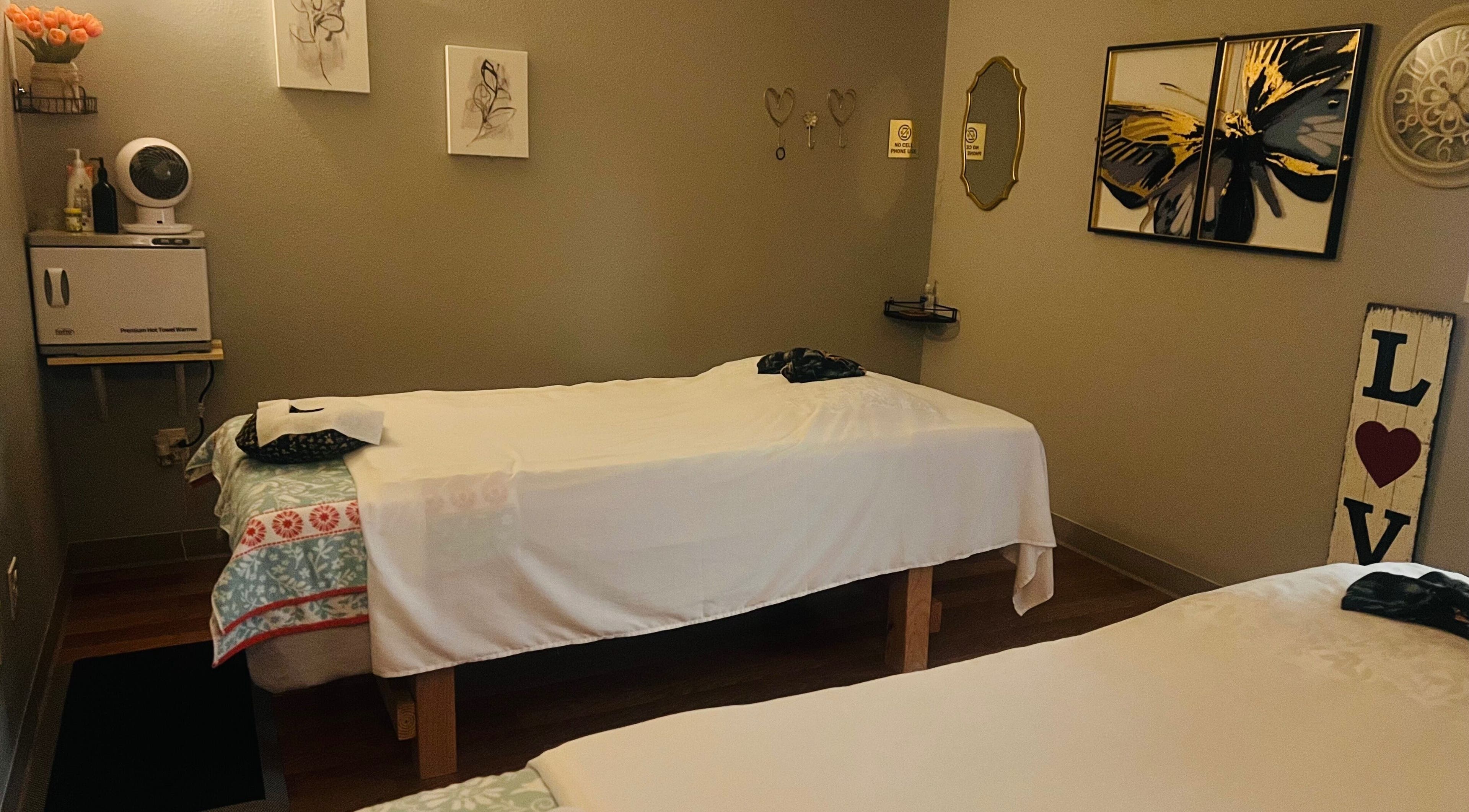 Cozy massage room with soft lighting at Jasmine Thai & Spa, Clovis, California, US.