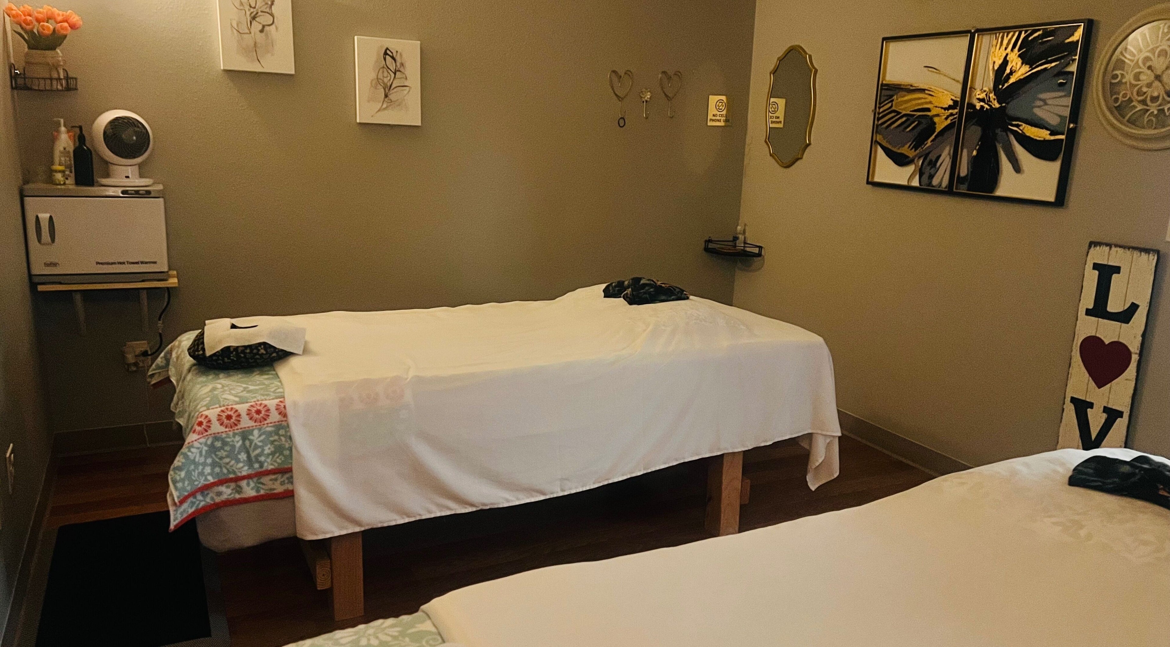 Cozy massage room with soft lighting at Jasmine Thai & Spa, Clovis, California, US.