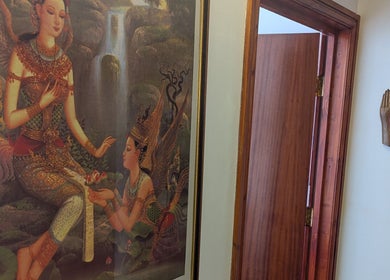 Elegant Thai wall art at AK Thai Solution Massage, Dudley, England, showcasing cultural beauty.