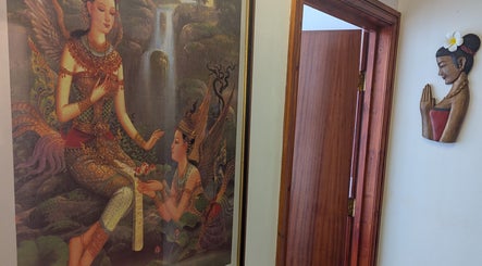 Elegant Thai wall art at AK Thai Solution Massage, Dudley, England, showcasing cultural beauty.
