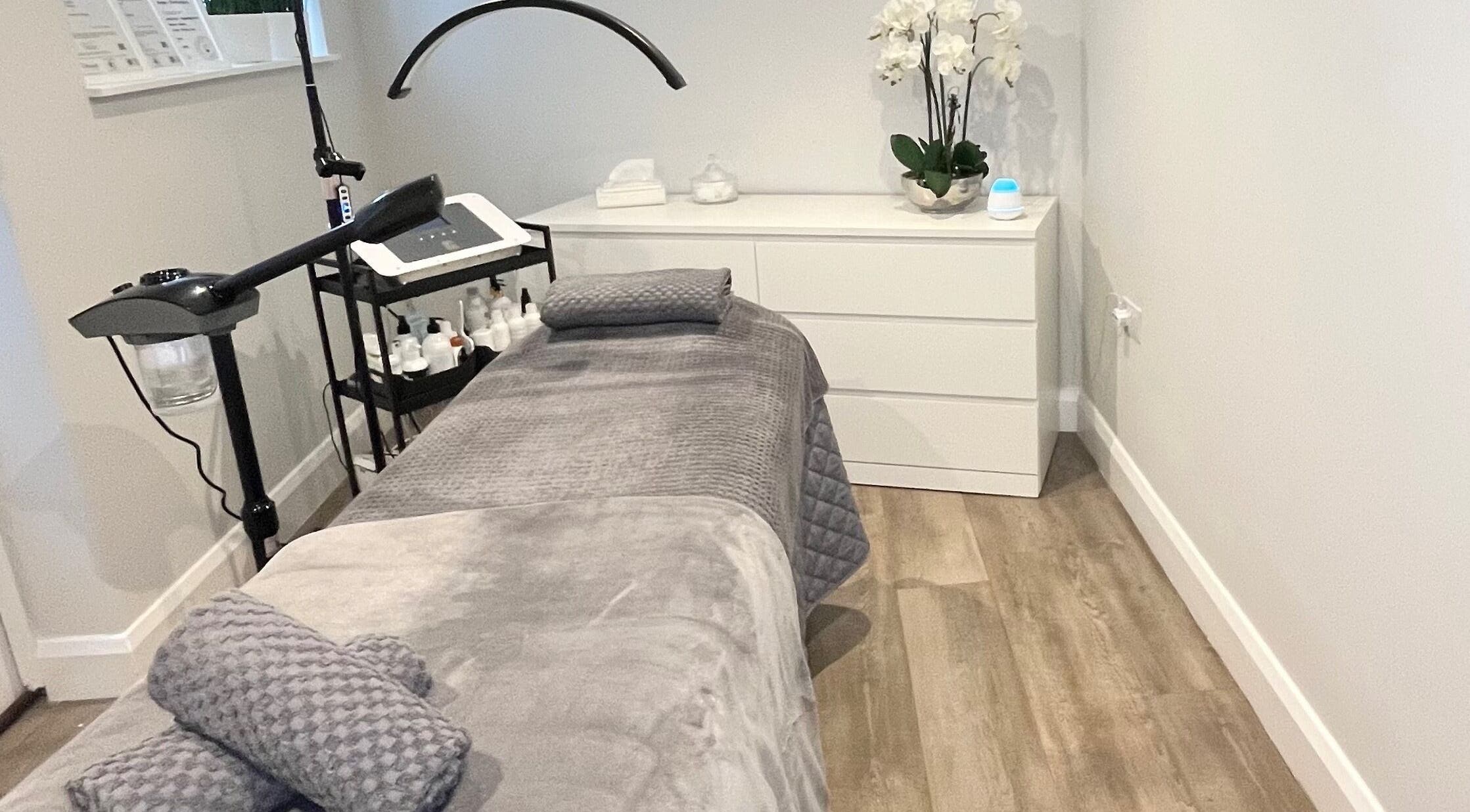Cozy treatment room at The Beauty Lounge BK, Twickenham, England, GB, featuring a plush spa bed.