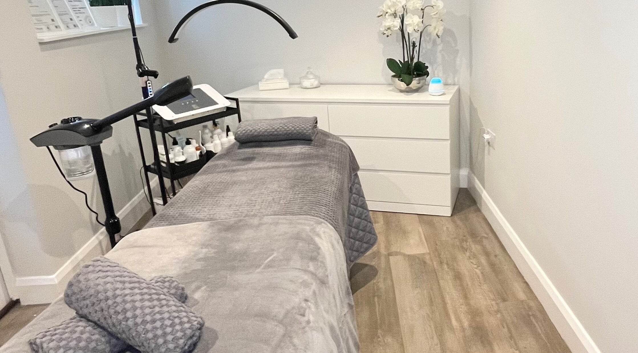 Cozy treatment room at The Beauty Lounge BK, Twickenham, England, GB, featuring a plush spa bed.