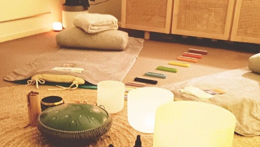 Relaxing therapy space at Michaela's Holistic Beauty in Victoria, Victoria, AU with candles and cushions.