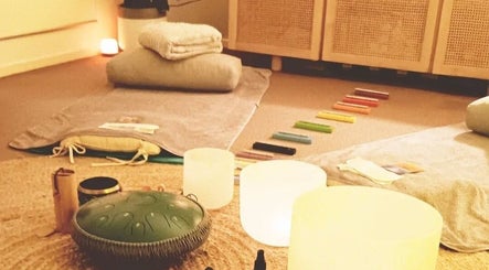 Relaxing therapy space at Michaela's Holistic Beauty in Victoria, Victoria, AU with candles and cushions.