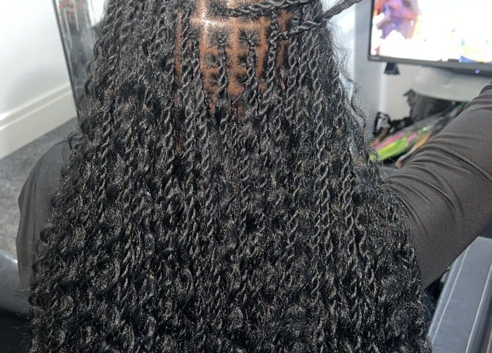 Stylish twist hairstyle at Hairbyshile, Leicester, England, GB. Elegantly braided for a chic look.