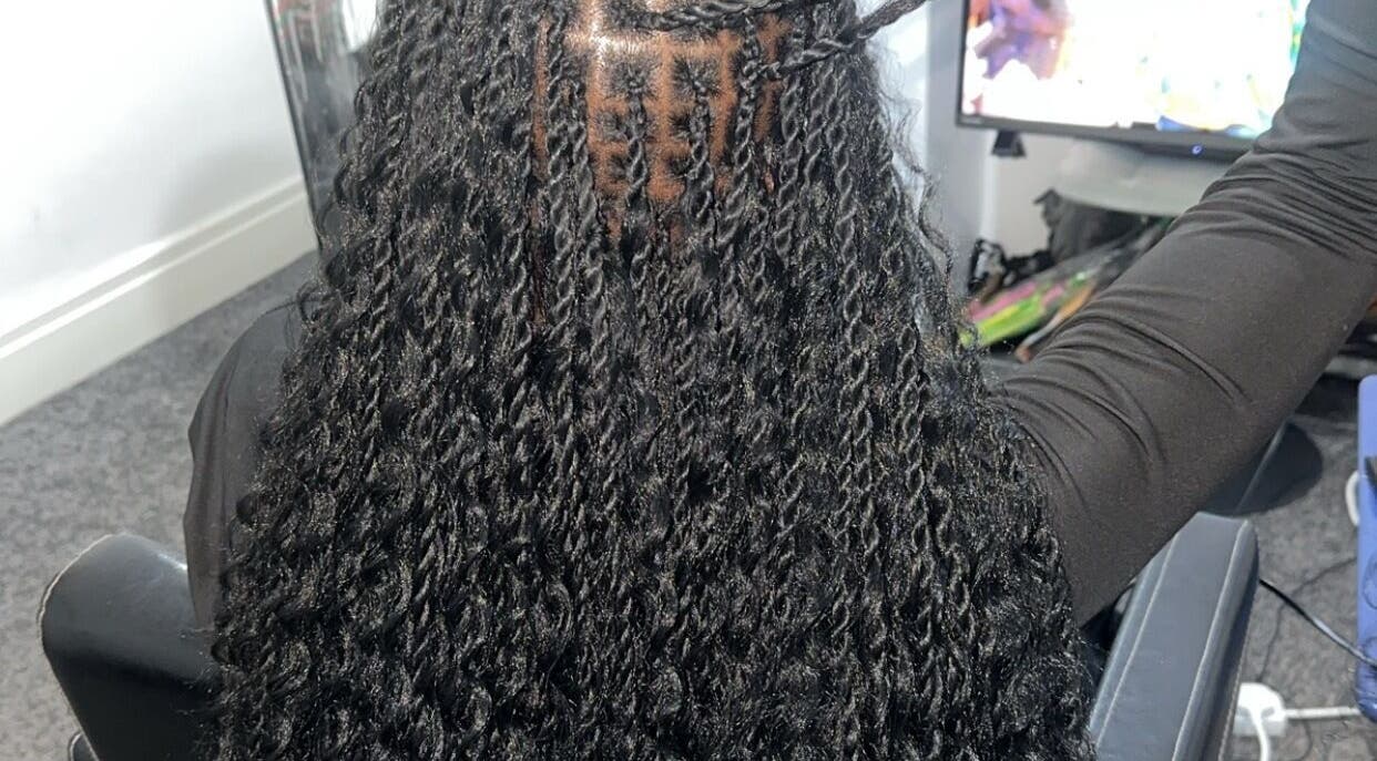 Stylish twist hairstyle at Hairbyshile, Leicester, England, GB. Elegantly braided for a chic look.