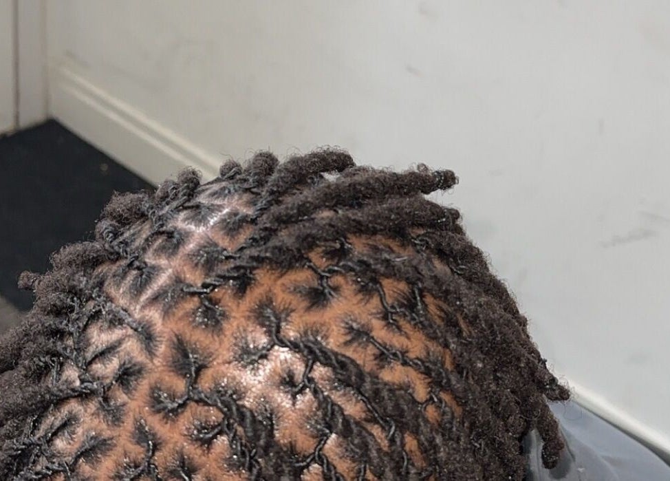Close-up of well-crafted dreadlocks at Hairbyshile, Leicester, England, GB, showcasing professional styling.