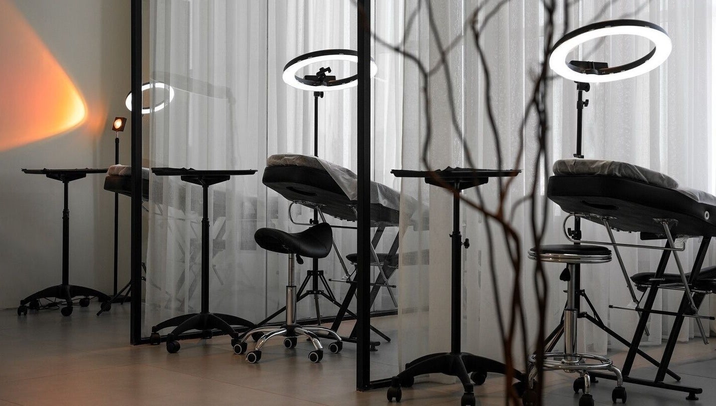 Modern treatment area at Shades by Ebtihal, Al Khobar, Eastern Province, SA with sleek chairs and lighting.