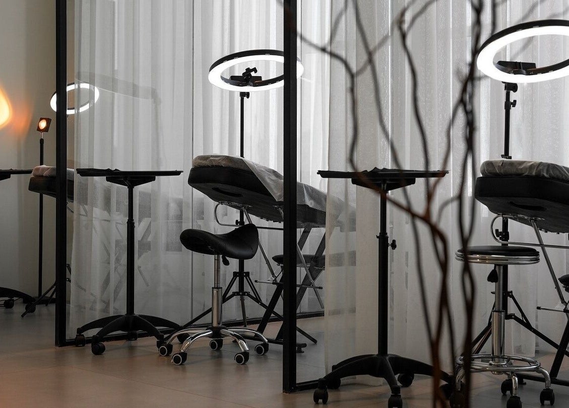 Modern treatment area at Shades by Ebtihal, Al Khobar, Eastern Province, SA with sleek chairs and lighting.