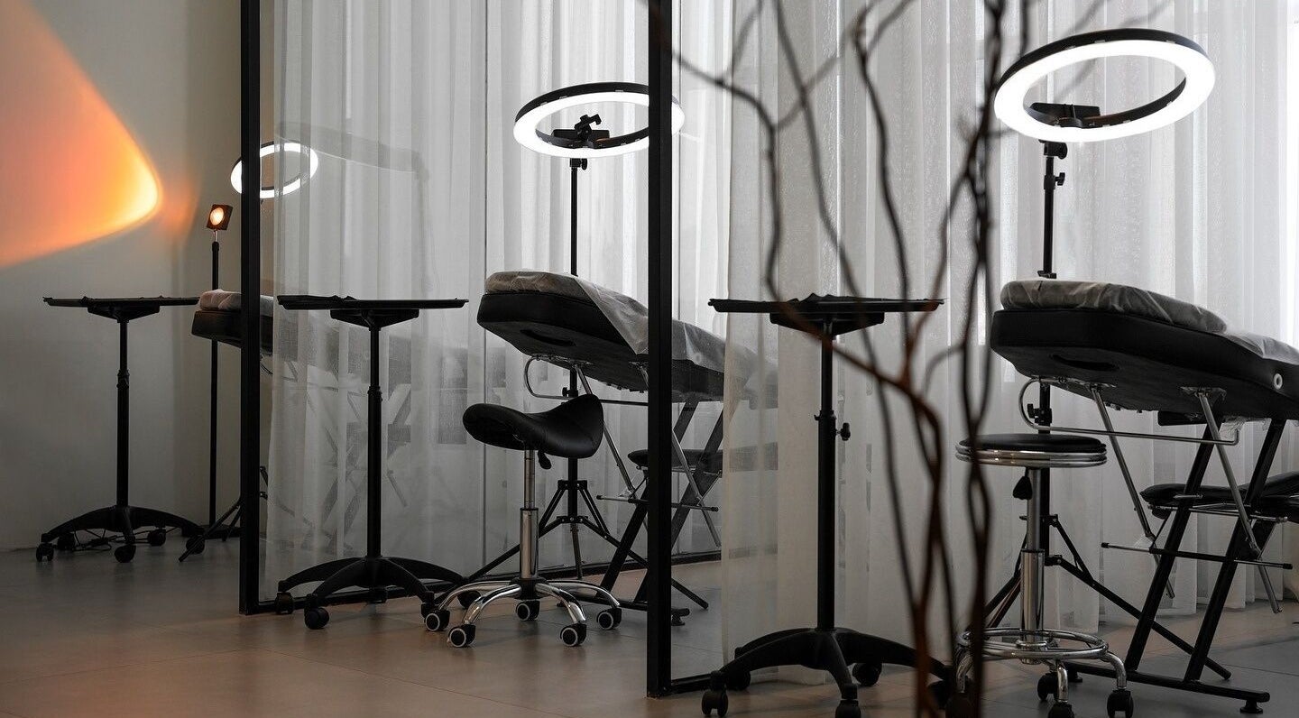 Modern treatment area at Shades by Ebtihal, Al Khobar, Eastern Province, SA with sleek chairs and lighting.