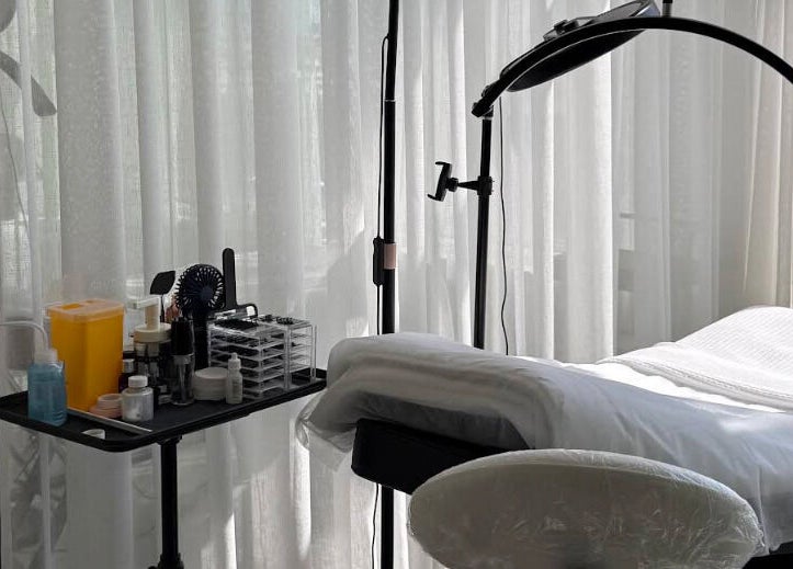 Treatment room at Shades by Ebtihal, Al Khobar, Eastern Province, SA, featuring a massage bed and tools.