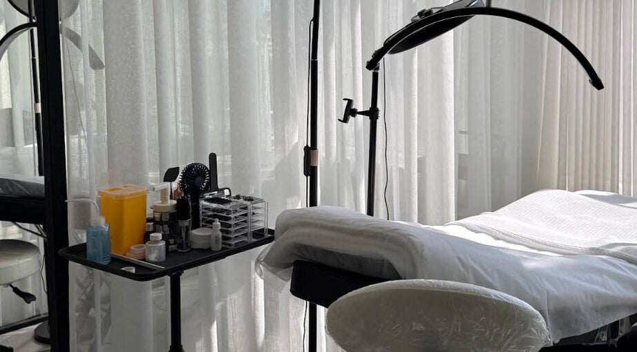 Treatment room at Shades by Ebtihal, Al Khobar, Eastern Province, SA, featuring a massage bed and tools.