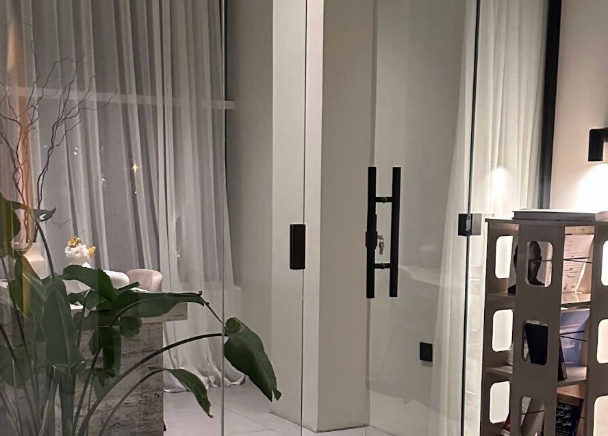 Tranquil interior of Shades by Ebtihal in Al Khobar, Eastern Province, SA featuring lush greenery and soft lighting.