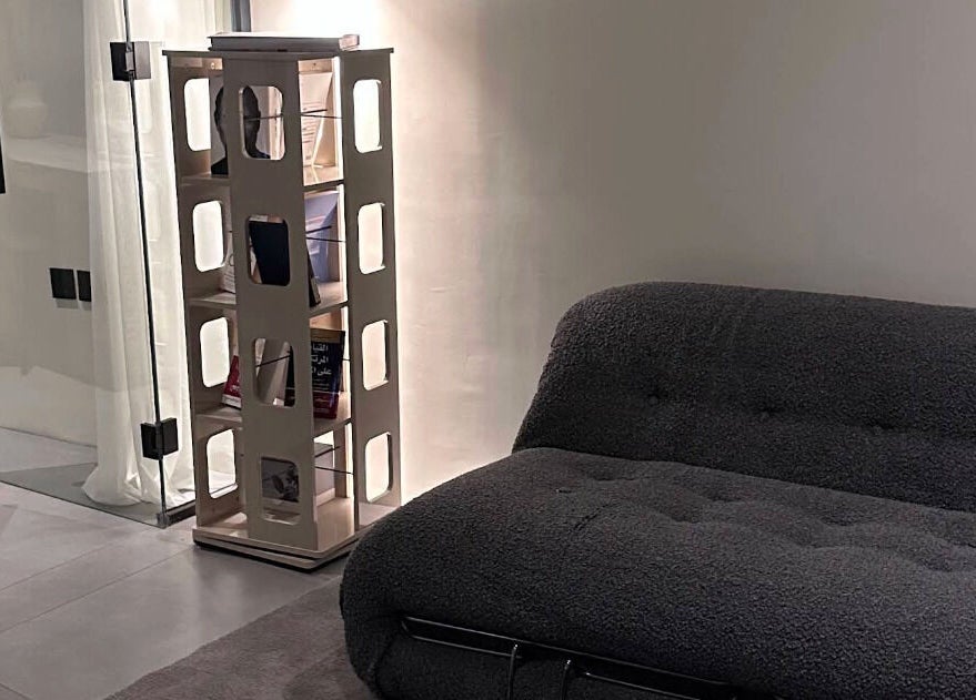 Chic lounge area at Shades by Ebtihal, Al Khobar, Eastern Province, SA with a modern grey sofa.