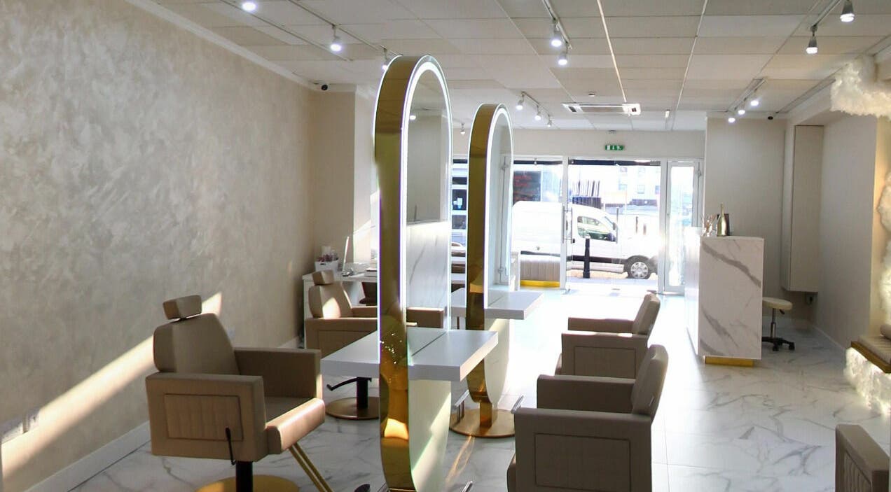 Spacious, elegant interior of Laser by Alexsa in Aberdeen, Scotland, GB with stylish chairs and mirrors.